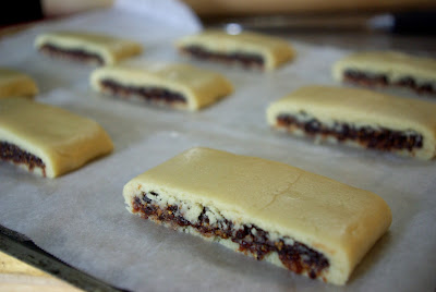 Paleo primal fig newtons sliced on baking sheet to go in oven