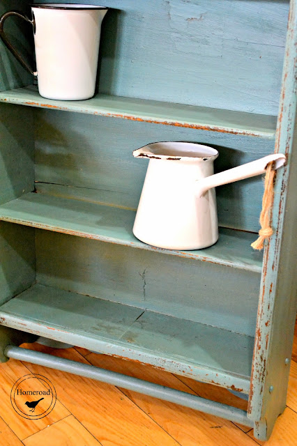 enamelware on shelf with chippiness