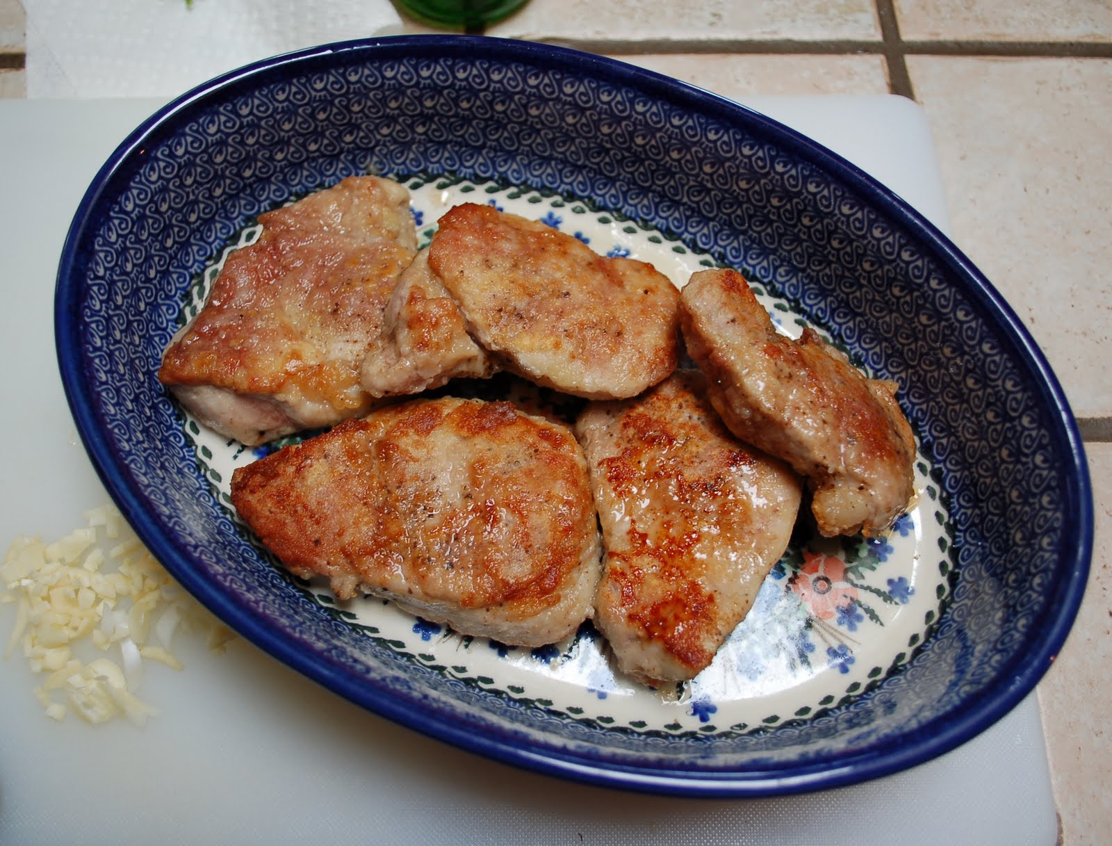 The Spice Garden Pork Scallops Smothered in Onion Mustard Sauce