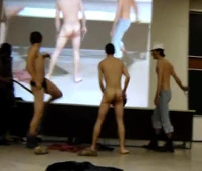 College lad strip dance on stage.