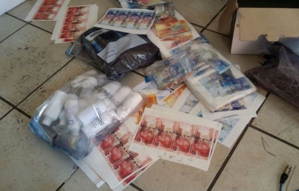  Photos: South African Police arrest Nigerian man found in possession of huge stash of counterfeit money