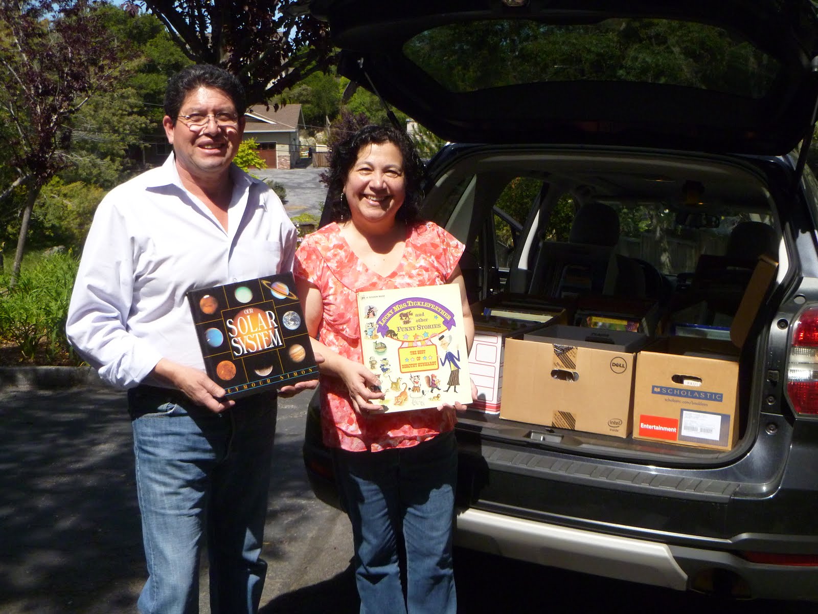 Making an Impact on Literacy by donating 8 boxes full of books to Familias Unidas