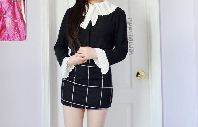 Twist X Turn Fashion Review: Monochrome Minimalist Tops Details on the ruffled pleated black-and-white self-tie long sleeve button down blouse from Twist X Turn, paired with a black grid bodycon skirt.