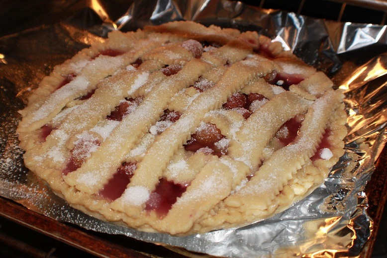The perfect and Best strawberry rhubarb pie made from scratch the crust is homemade pie dough and the filling is all made with fresh ingredients. The pie has sugar on top and lattice crust