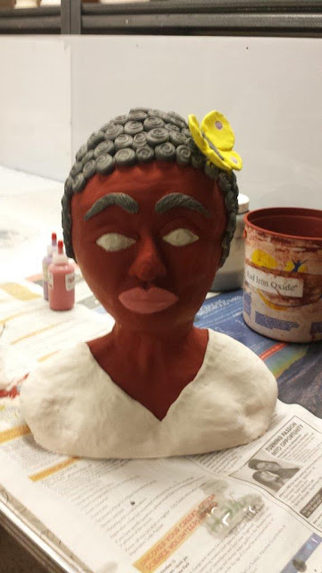 Sculptural clay pottery bust of a Negro woman, in progress, stained.