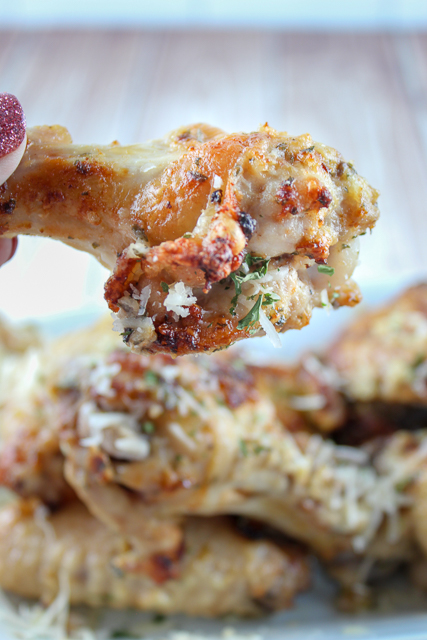 Garlic Parmesan Chicken Wings are my FAVORITE - I used to order them all the time from the pizza place up the street - but not any more! Now I make them at home in less time than the pizza delivery! These Air Fryer Garlic Parmesan Chicken Wings are the perfect dinner or party appetizer! #garlicparmesan #chickenwings #airfryer