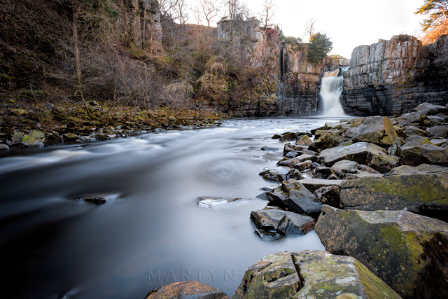 High Force waterfall in the Pennines North Yorkshire with silky water and large boulders