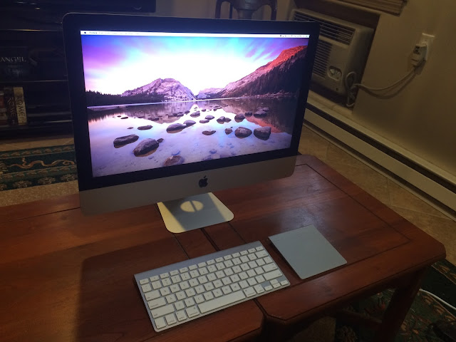 Photo of an iMac on a coffee table