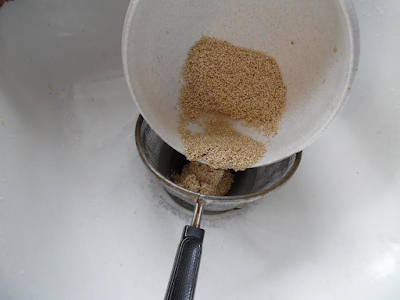 Photo of quinoa being poured into strainer