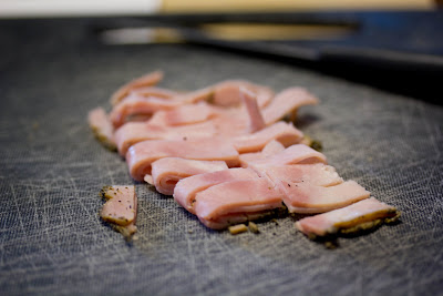 sliced ham on a cutting board