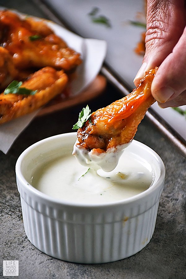 Dipping a low carb buffalo wing into the most amazing Gorgonzola cheese dipping sauce.