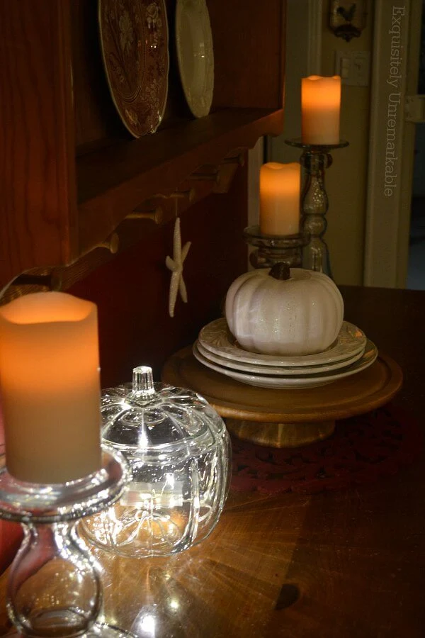 Glass Pumpkin Lit on Table with cancles