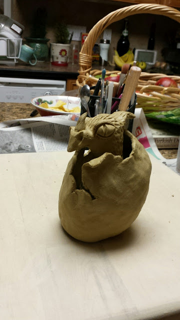 Hatching ceramic dragon, in progress, by Lily L.