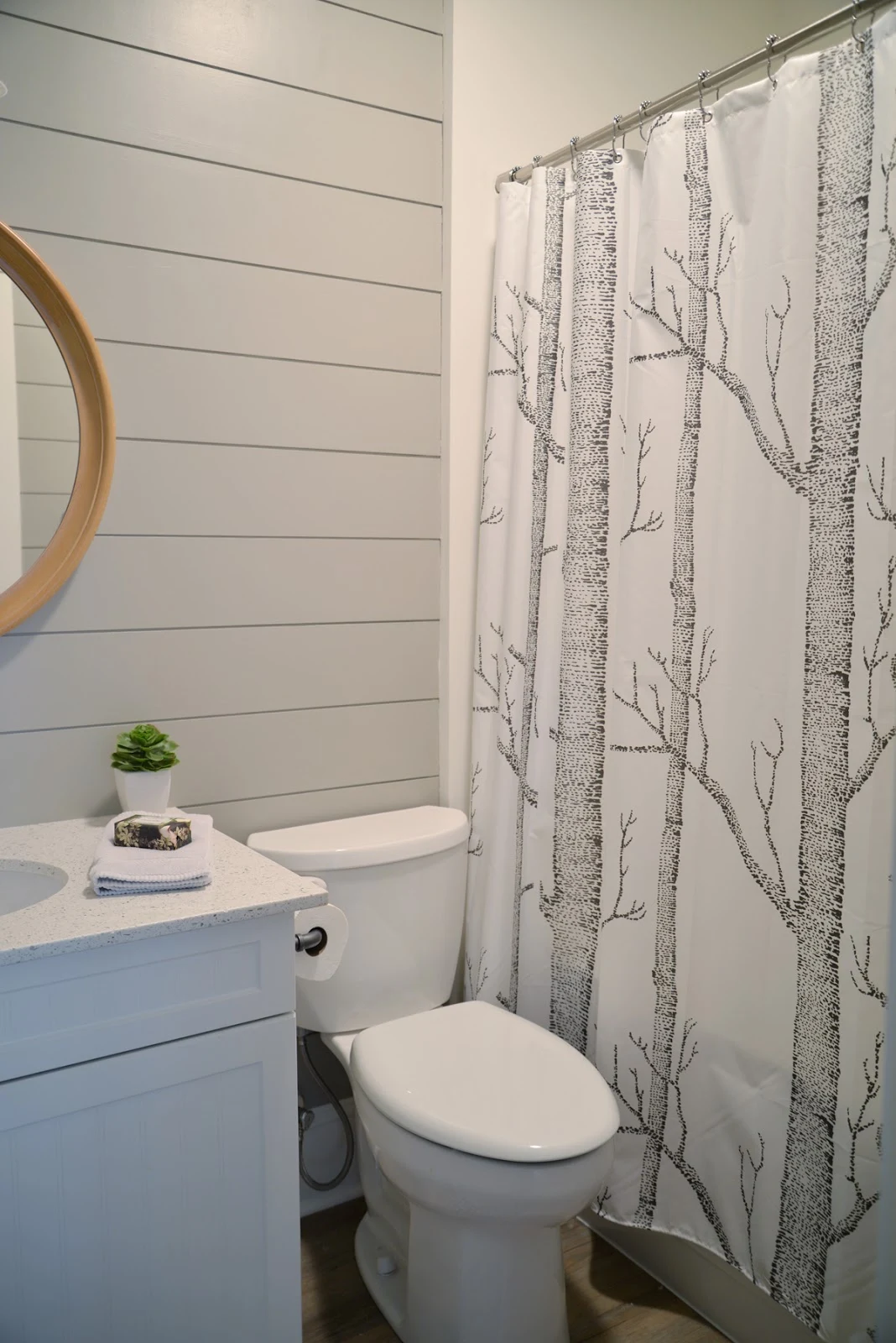 grey painted shiplap in the bathroom, woods shower curtain | Ramblingrenovators.ca