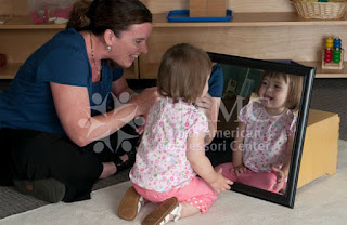 NAMC Montessori ams conference brain research teacher and child work with mirror