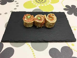Salmon roll with cream cheese with boletus and asparagus