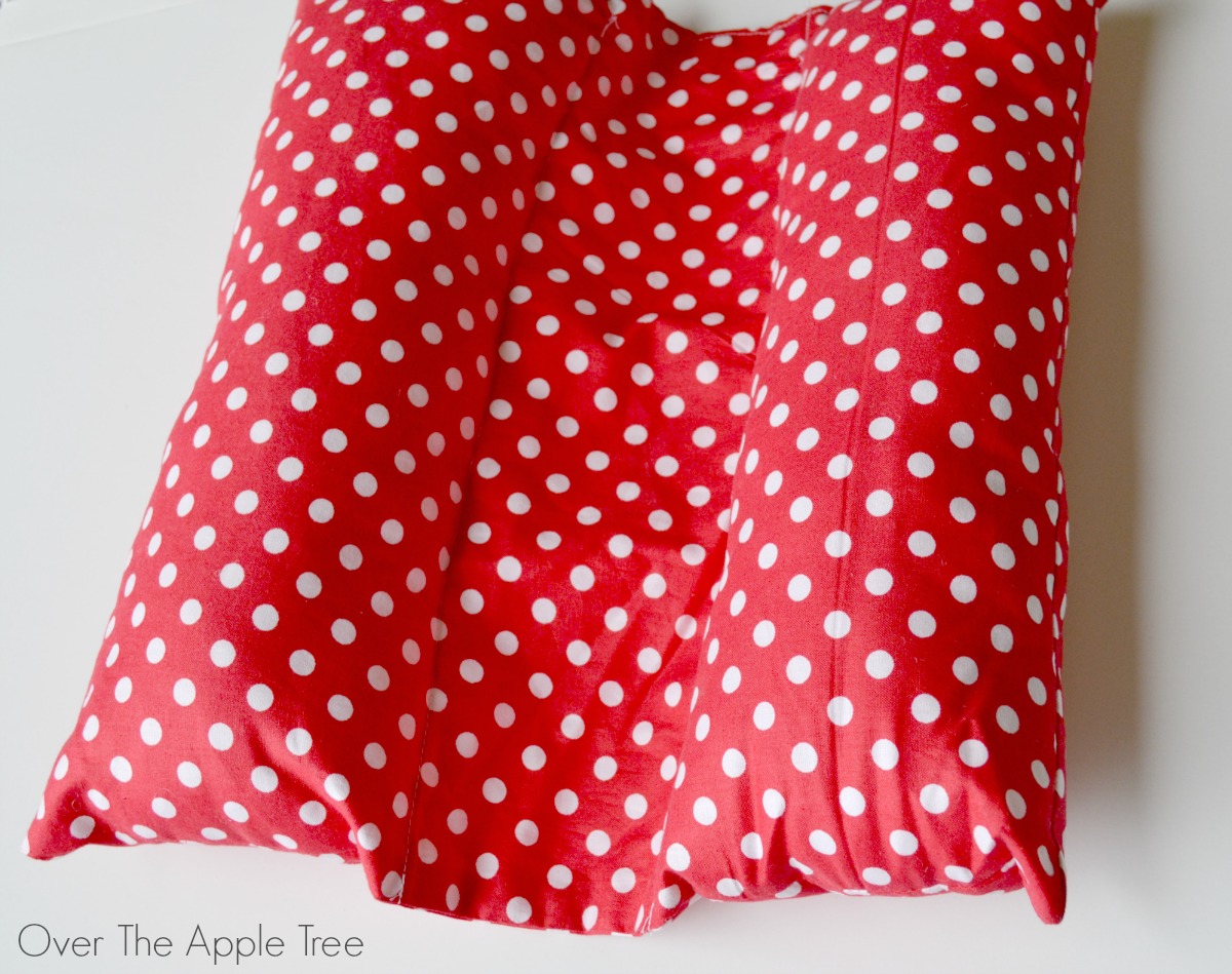 Over The Apple Tree Seat Belt Pillow