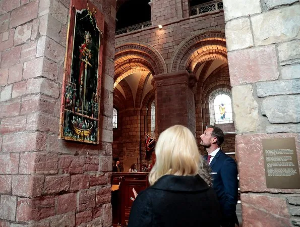 Crown Princess Mette-Marit and Crown Prince Haakon attended St. Magnus festival in Scotland. Prada dress, Christian Louboutin pumps