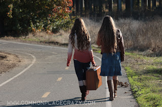 girls walking with suitcase