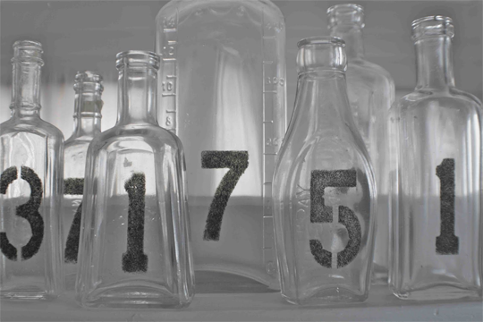 numbered glass bottles
