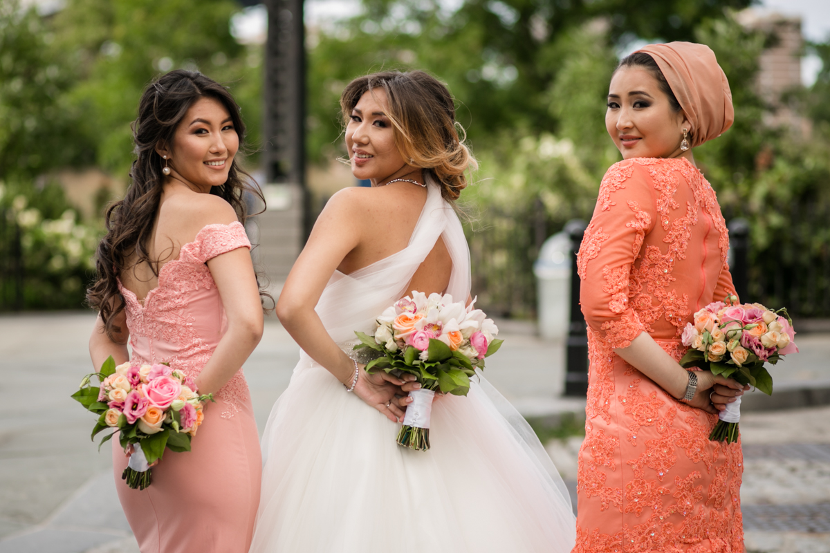Beautiful Bride and Her Crew Displaying Their Colorful Flowers