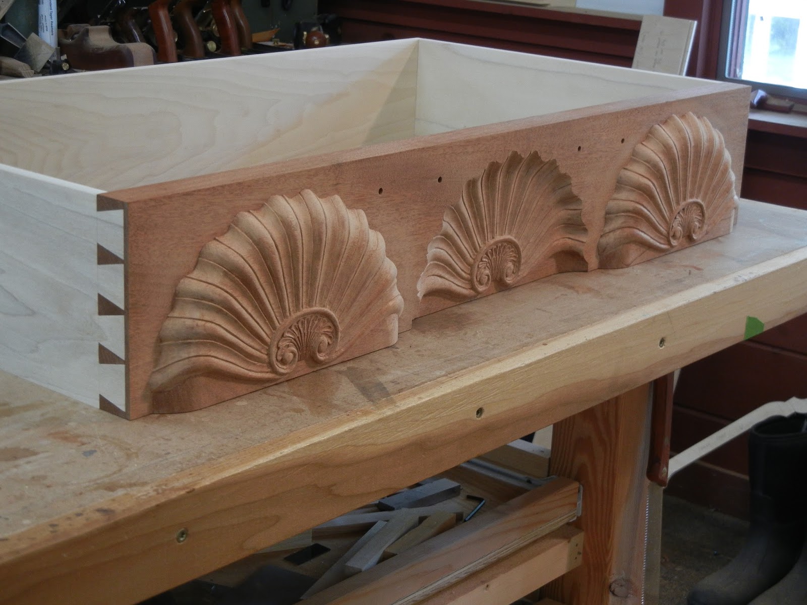 hand carved shells and dovetails 