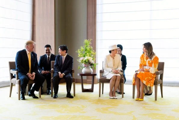 Melania Trump wore Dries van Noten floral print cotton coat. Naruhito and Empress Masako at Tokyo hotel