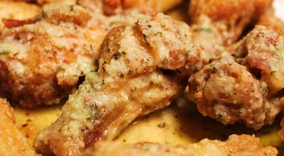 chicken wing sauce with garlic, parmesan, roasted garlic, spicy garlic, marsala sauce, these chicken wings are fried and coated with homemade chicken wing sauce hot sauce