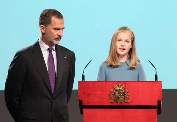 Queen Letizia wore Felipe Varela suit and Magrit Pumps, carried Hugo Boss Fanila clutch bag, Leonor and Sophia Carolina herrera dress