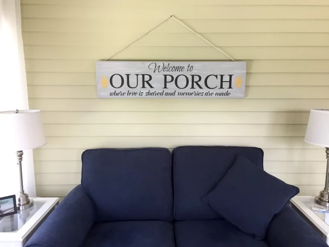 Finished sign hanging over blue sofa