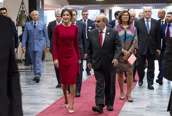 Queen Letizia wore Carolina Herrera red dress, carried Felipe Varela clutch bag. Queen visited the Spanish Royal Academy in Rome