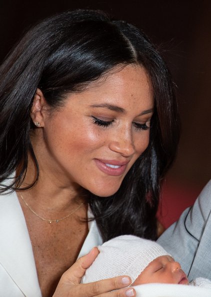 Meghan Markle wore a bespoke cream trench-style dress designed by British fashion designer Grace Wales Bonner