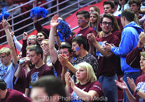 SJO student fans cheer for their team during set 2.