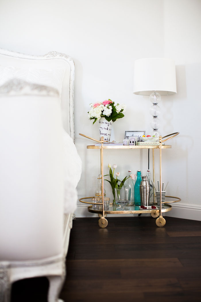A gold bar cart makes a charming and creative bedside table. {Décor