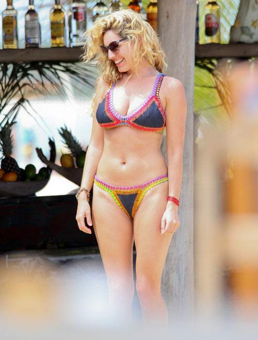 Kelly Brook into Swimwear at Ibiza Beach