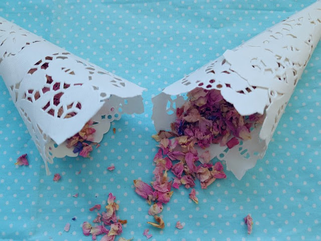 Looking to make your own DIY confetti cones?  Here is a great tutorial for cute, cheap and easy doily confetti cones!