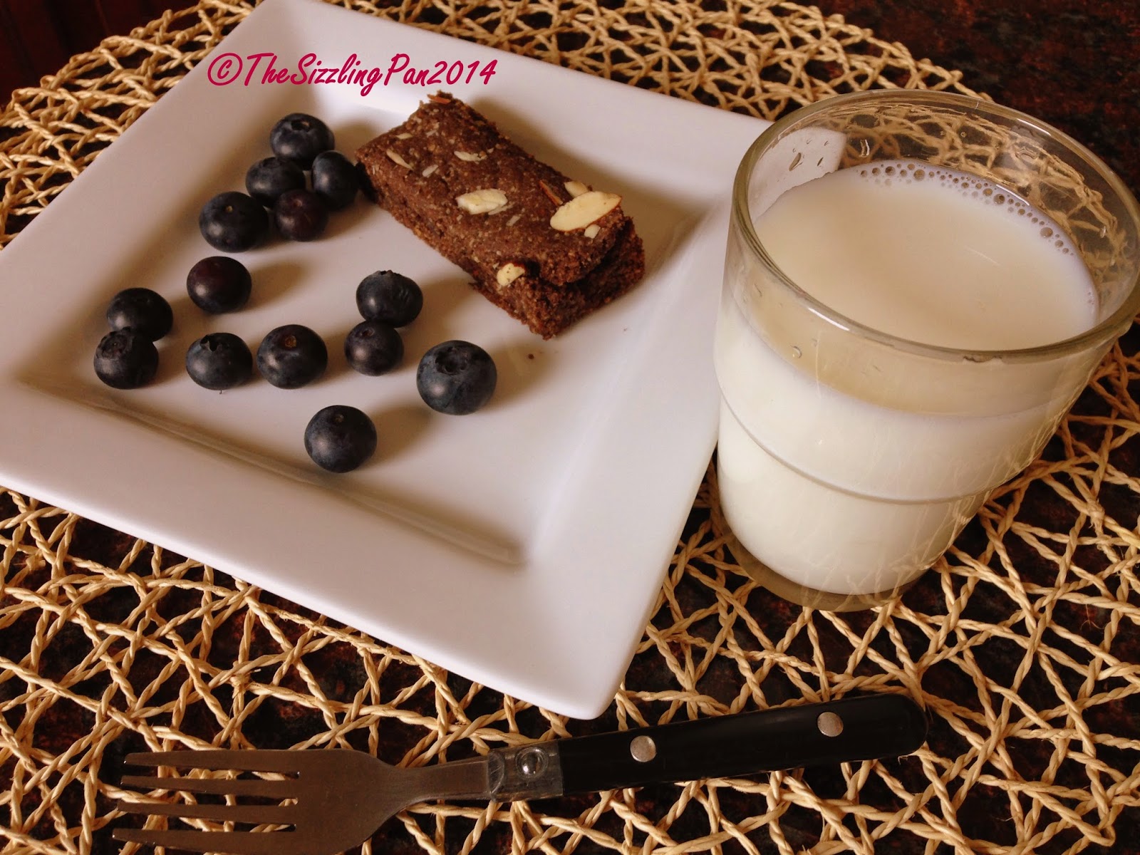 The Sizzling Pan OatsAlmond Breakfast bars (Eggless)