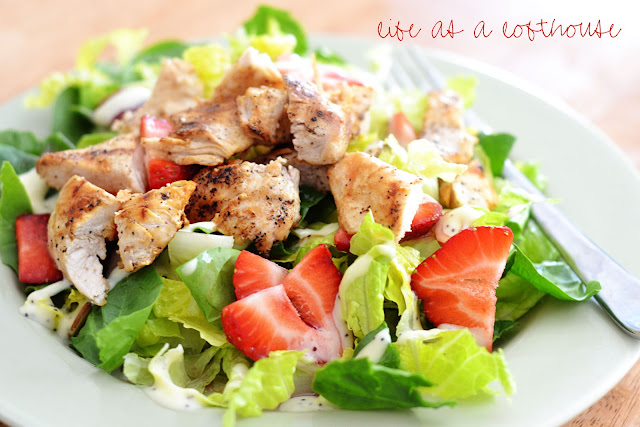 Strawberry Chicken Salad is filled with chopped romaine lettuce, sprinkles of sliced almonds, sliced strawberries and grilled chicken. Life-in-the-Lofthouse.com