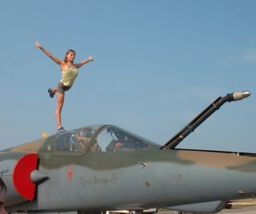 girl-stretching-on-plane