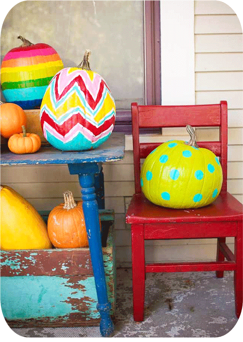 primary coloured painted pumpkins
