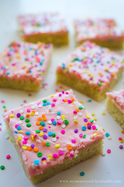 Sugar Cookie Sprinkle Bars!!! All in when it comes to anything with pink frosting and rainbow sprinkles! These bars taste as great as regular sugar cookies, but only take half the time with no messy clean up. | mynameissnickerdoodle.com Sugar Cookie Sprinkle Bars!!! All in when it comes to anything with pink frosting and rainbow sprinkles! These bars taste as great as regular sugar cookies, but only take half the time with no messy clean up. | mynameissnickerdoodle.com