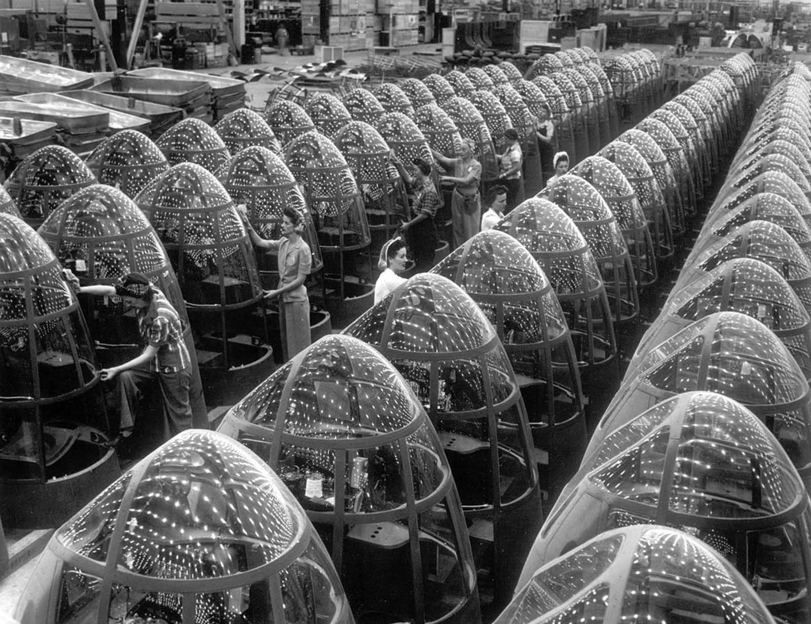 Women workers groom lines of transparent noses for the A-20J attack bombers at Douglas Aircraft's in Long Beach, California, in October of 1942.
