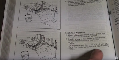 owner's manual depicting installation of new oil filter
