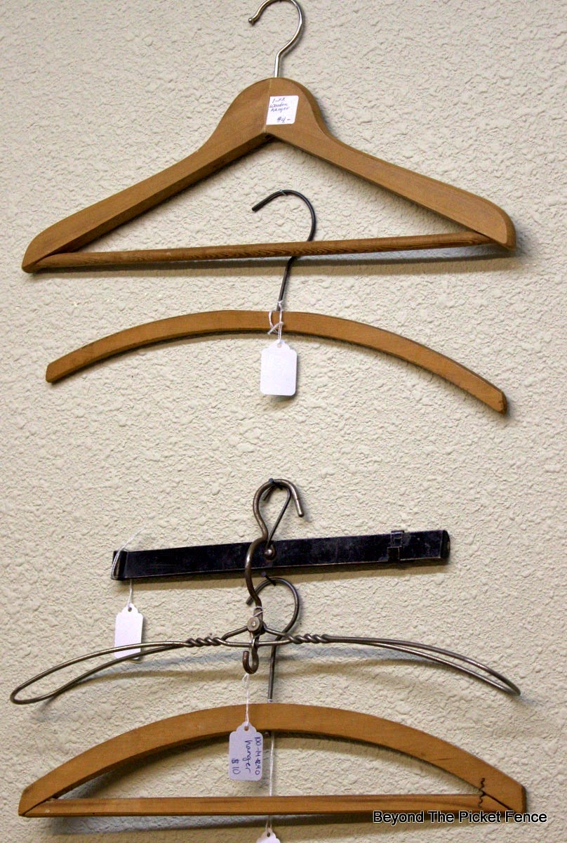antique hangers, decorating ideas, wall art, Beyond The Picket Fence, http://bec4-beyondthepicketfence.blogspot.com/2015/02/5-decorating-lessons-from-store.html
