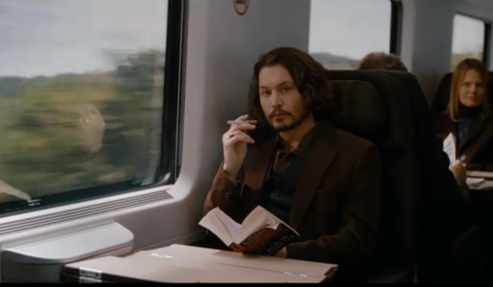 BoxOfficeMovies Johnny Depp Smokes an Electronic Cigarette on The Train