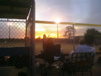 Sunset in Bement, a train going by in the background, and #9 on deck is my #5 daughter Alyssa
