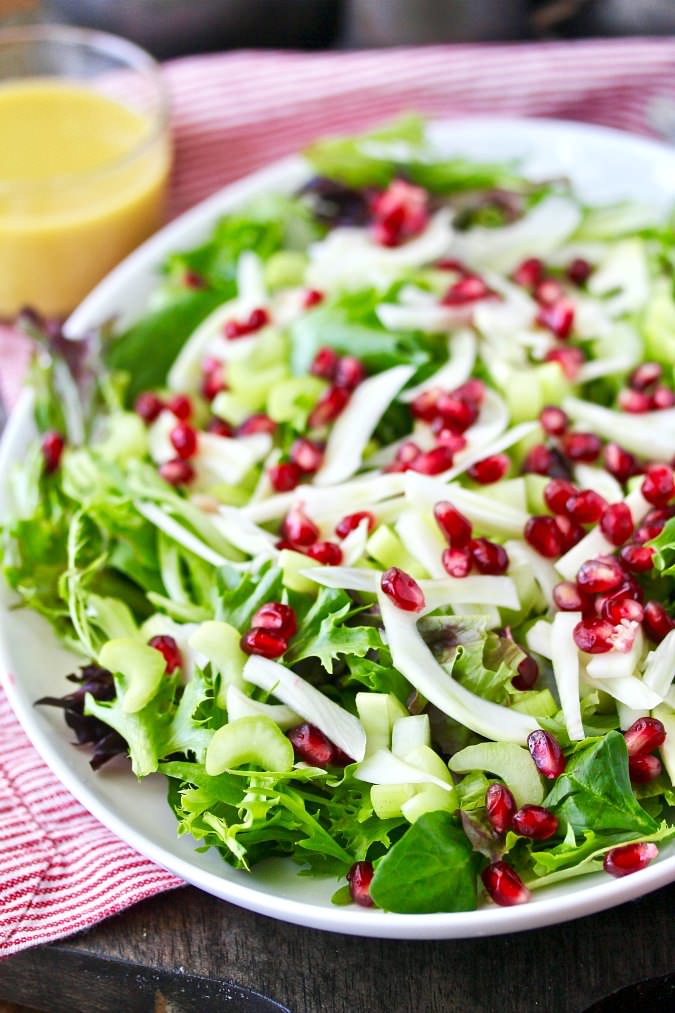 Fennel, Pomegranate, and Baby Greens Salad with honey mustard dressing
