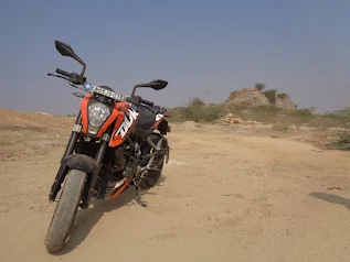 KTM Duke and Pulsar bikes riding on the highway in the morning