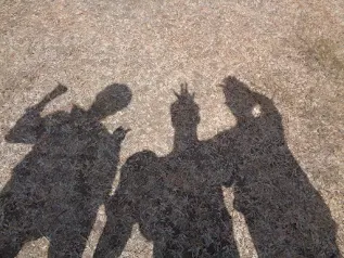 Adi's uncle showing the group around the town's temples and wells