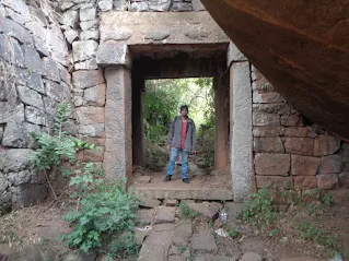 Sippy amidst the ancient gateways and fort walls on the hutridurga trek